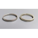 An 18ct gold decagonal wedding band (worn), size K, 2.9 grams and a white metal wedding band stamped