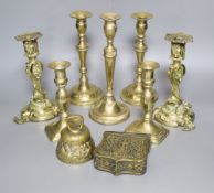 A group of brassware including candlesticks