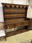 An 18th century style oak dresser, width 182cm depth 45cm height 198cm