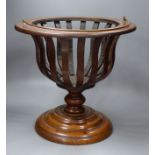 An early 20th century Dutch walnut jardiniere, lacking brass liner