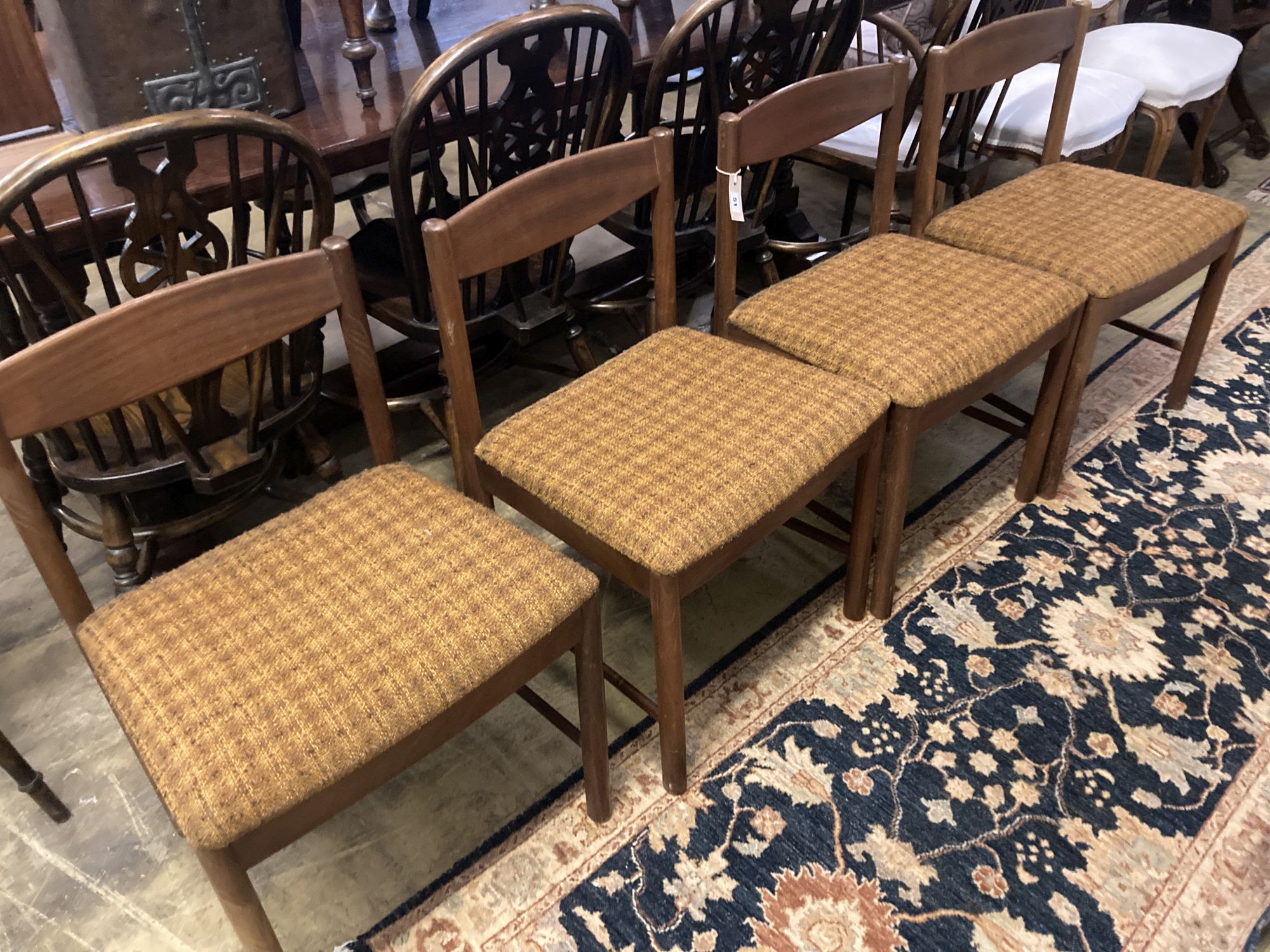 A set of four mid century Macintosh teak dining chairs, model 4003