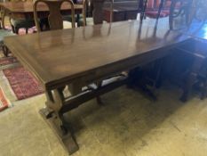 An 18th century style oak draw leaf dining table, width 150cm, depth 75cm, height 77cm