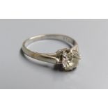 A white metal and old mine cut solitaire diamond ring, size M, gross 2.6 grams, the stone weighing