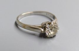A white metal and old mine cut solitaire diamond ring, size M, gross 2.6 grams, the stone weighing
