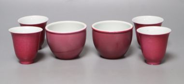 Four Chinese ruby ground tea cups and a pair of similar pots, height 6cm