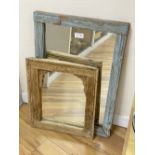 A South East Asian carved wood framed wall mirror and another