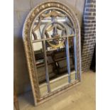 A reproduction parcel gilt arched top wall mirror, width 120cm, height 180cm