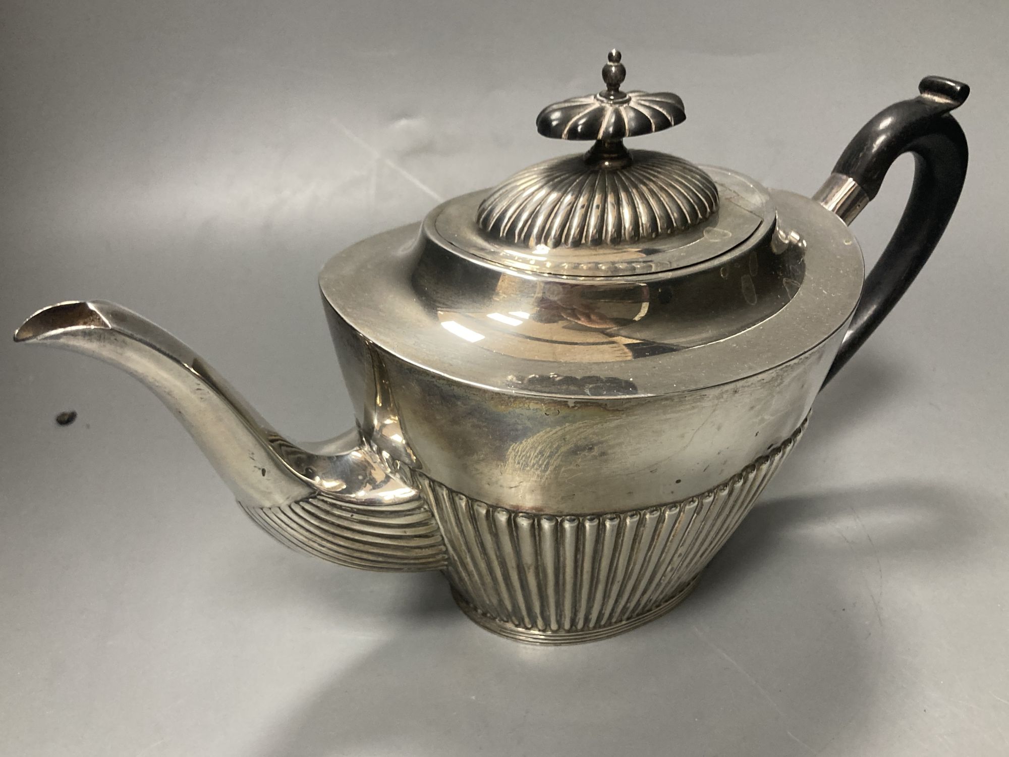 A late Victorian demi fluted silver three piece tea set, Mappin & Webb, Sheffield, 1897 & a - Image 4 of 5
