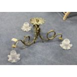 A cast brass three branch ceiling light with glass shades