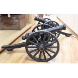A pair of cast iron models of cannons, length 71cm
