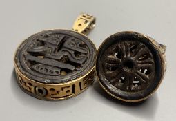 An unusual Chinese pierced gilt metal and base metal inset ring, size P, and matching pendant,