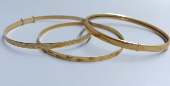 Three modern 9ct gold bangles, 15.8 grams.