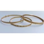 Three modern 9ct gold bangles, 15.8 grams.