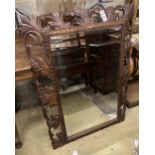 An early 20th century rectangular carved oak wall mirror, width 80cm, 110cm high