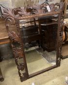 An early 20th century rectangular carved oak wall mirror, width 80cm, 110cm high