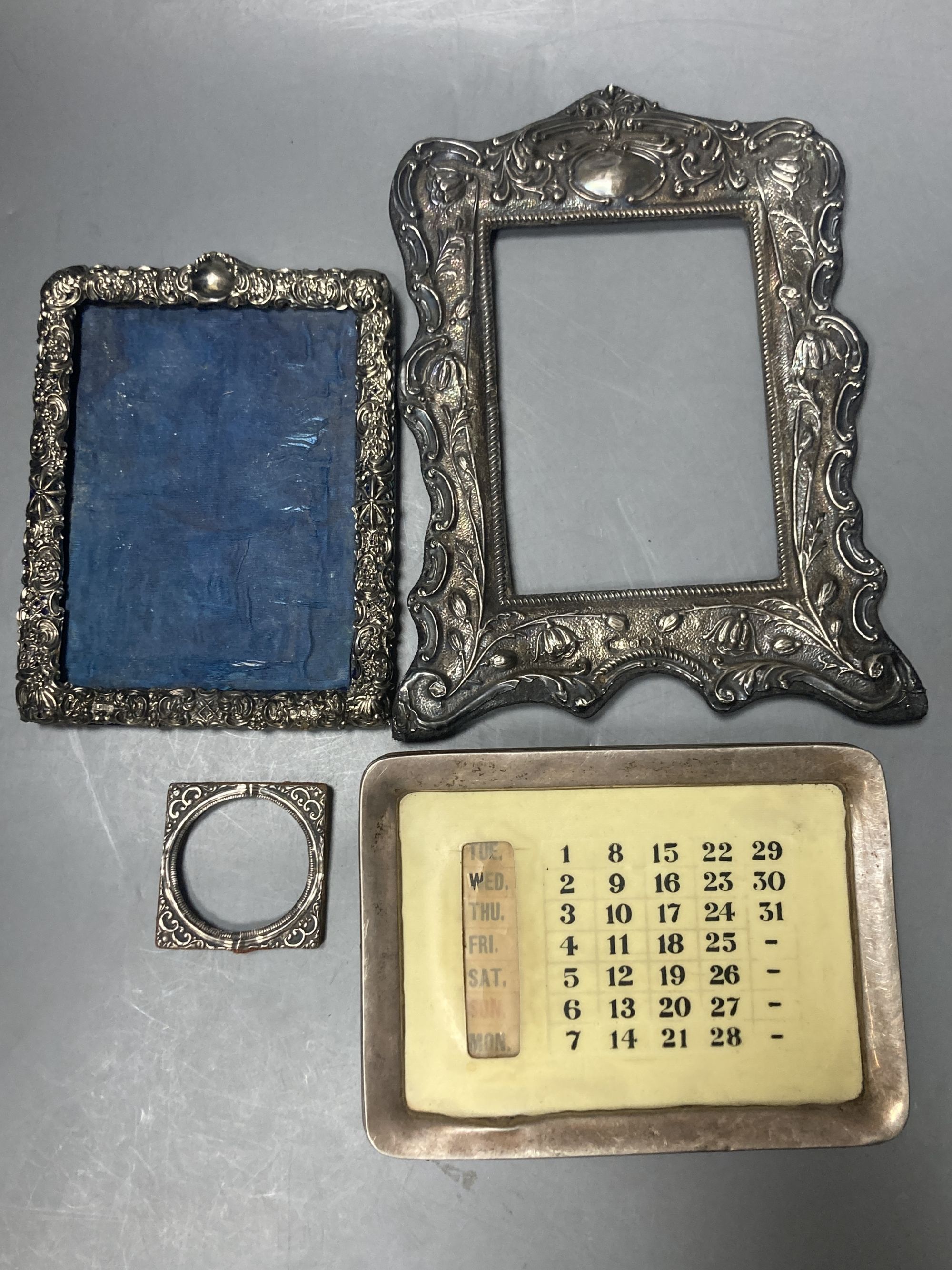 A George V silver mounted desk calendar and three late 19th/early 20th century silver mounted