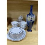 A Royal Doulton 'Burgundy' pattern tea cups and saucers and a Doulton stoneware vase