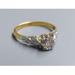 A 1960's 18ct gold and illusion set solitaire diamond ring, size J/K, gross 2.4 grams.