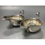 A pair of Edwardian silver sauceboats, Birmingham, 1906, height 8.9cm, 8.5oz.CONDITION: Minor