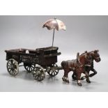 A cast iron model of a horse and carriage, length 37.5cm
