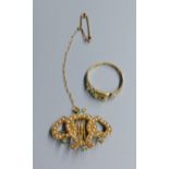 An Edwardian 18ct, turquoise and seed pearl set 'twin hearts with lyre' brooch, 28mm, gross 4.2