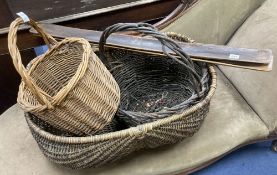 Three wicker baskets, a wirework basket and two baguette stands