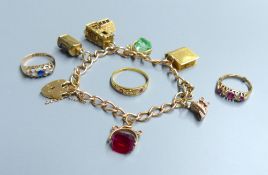 A 9ct gold charm bracelet, hung with six assorted charms including 9ct gold, gross 28.1 grams, an