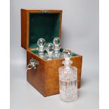 A Victorian oak four decanter box containing two pairs of cut glass decanters, overall height