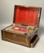 A 19th century mother of pearl inlaid rosewood travelling toilet box