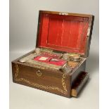 A 19th century mother of pearl inlaid rosewood travelling toilet box