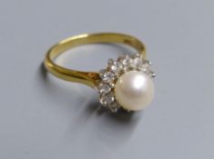 A modern 18ct gold, cultured pearl and diamond set cluster ring, size L, gross 4.4 grams.