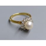 A modern 18ct gold, cultured pearl and diamond set cluster ring, size L, gross 4.4 grams.