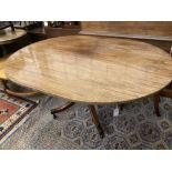 A George III oval mahogany tilt top dining table, width 158cm depth 120cm height 74cm