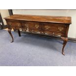 A mid 18th century style oak and mahogany crossbanded dresser, fitted three small drawers,