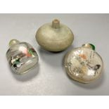 A Chinese inside painted rock crystal snuff bottle and inside painted glass snuff bottle and a small
