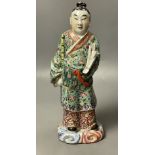 A Chinese famille rose porcelain figure of an immortal, probably Republic period