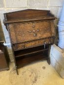 A 1920's oak bureau width 82cm, depth 31cm, height 112cm