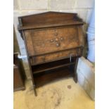 A 1920's oak bureau width 82cm, depth 31cm, height 112cm