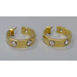 A modern pair of 18ct gold and five stone diamond set Cartier style half hoop earrings, 19mm,
