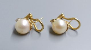 A modern pair of 14k, cultured pearl and diamond set earclips, gross 5.1 grams, pearl diameter 8.