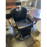 A black leatherette adjustable barber's chair, width 70cm, height 120cm