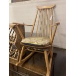 An Ercol stickback beech rocking chair