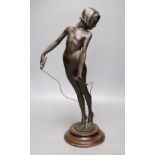 A spelter figure of girl with skipping rope, signed Alex Carnick?, height 49cm (a.f.)
