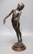 A spelter figure of girl with skipping rope, signed Alex Carnick?, height 49cm (a.f.)