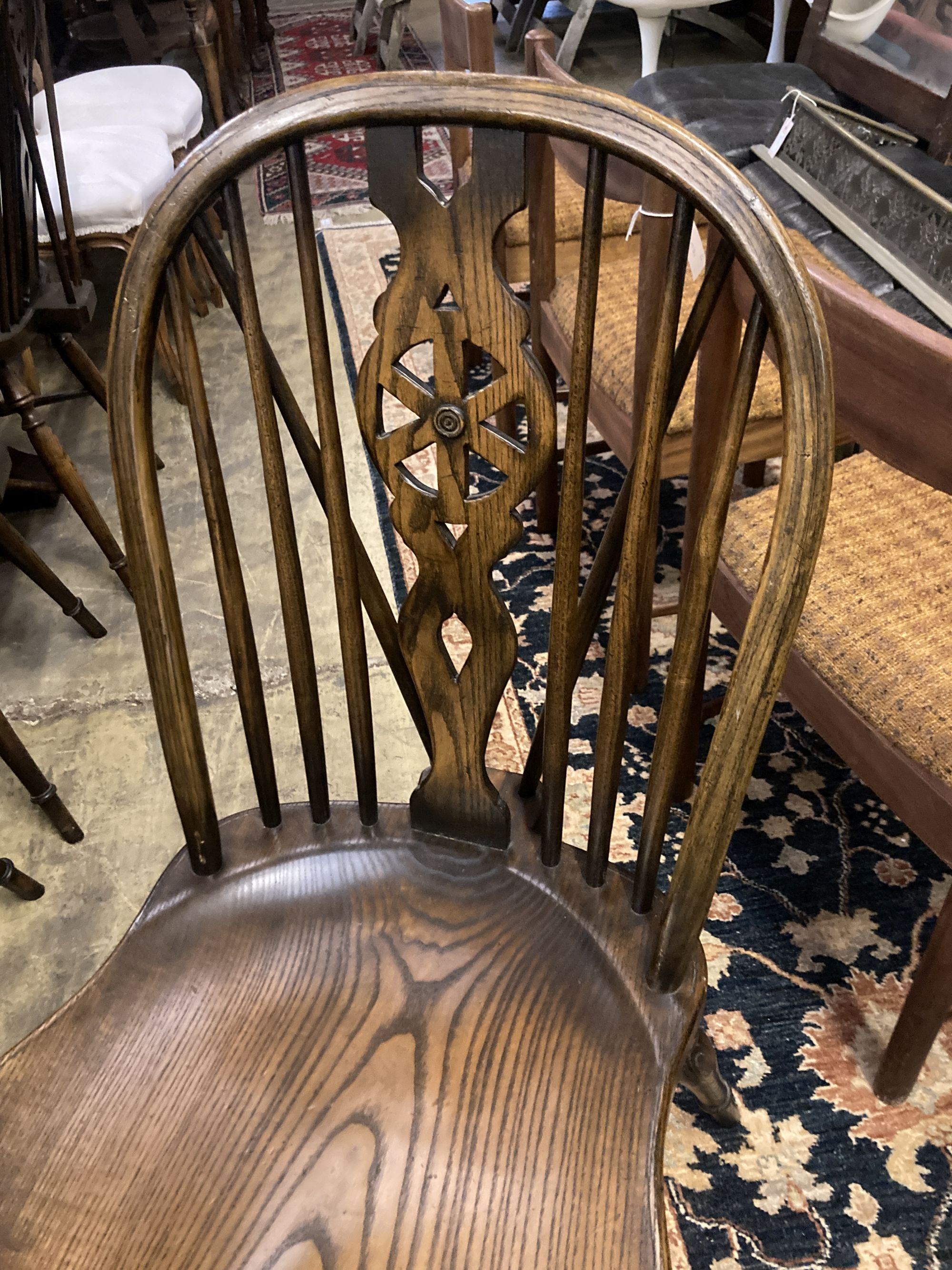 A set of ten stained ash and elm Windsor chairs with crinoline stretchers (two having arms) - Image 5 of 6