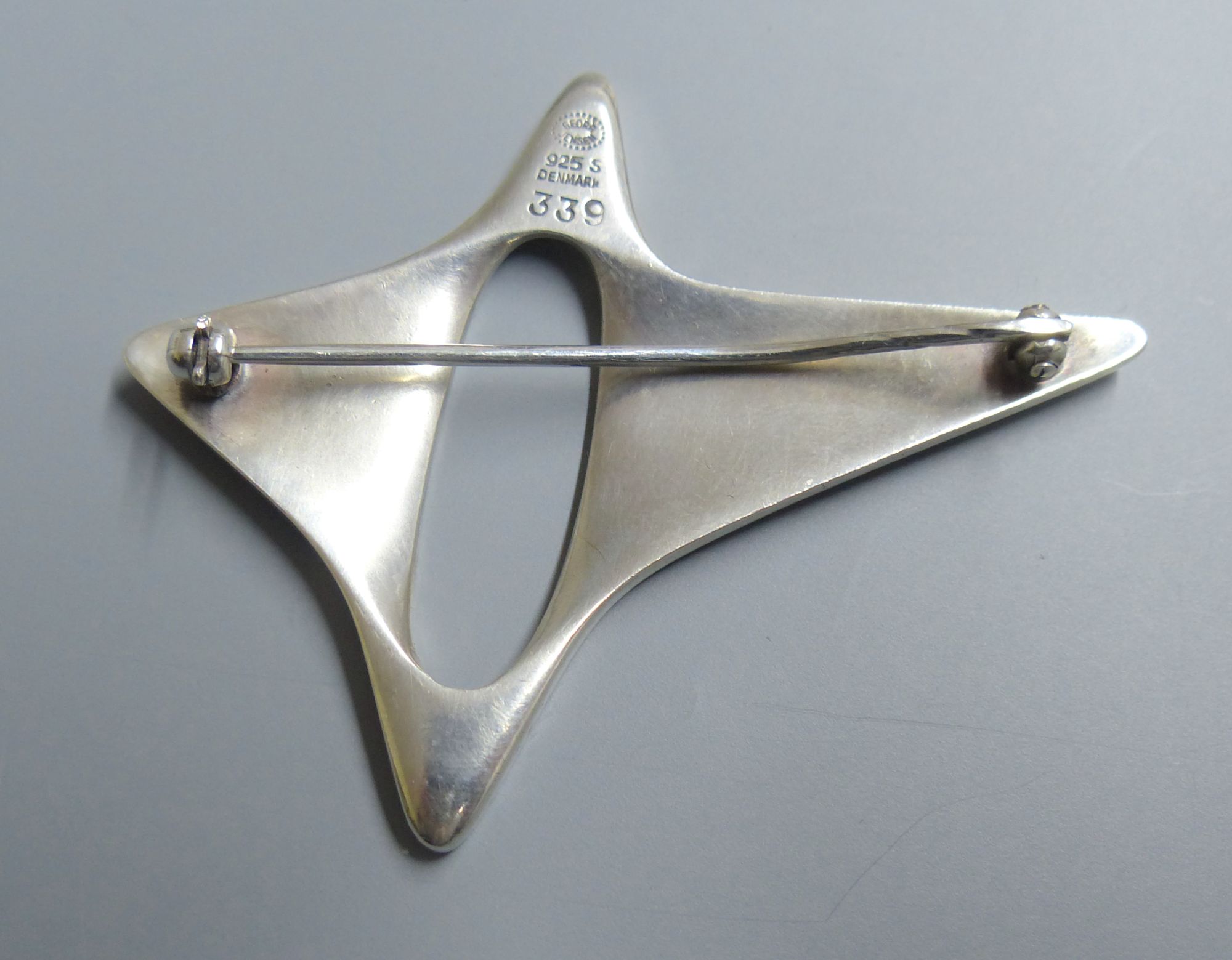 A Georg Jensen sterling abstract brooch, designed by Henning Koppel, no. 339, 57mm.CONDITION: Pin - Image 2 of 2