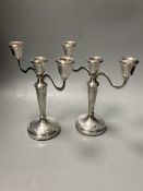 A modern pair of silver two branch, three light candelabra, Birmingham, 1988, 21.1cm, weighted.