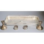 A plated tray, a pair of silver dwarf candlesticks and two napkin rings