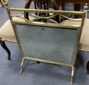 An Edwardian mirrored brass fire screen, width 60cm height 76cm