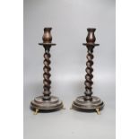 A pair of carved wood twist stem candlesticks, on gilt metal feet, height 39cm